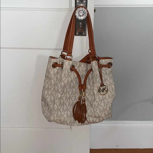 Michael Kors Handbags - White and tan Michael kors drawstring handbag.